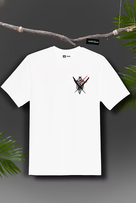 White t-shirt with graphic design hanging on a branch against a dark background