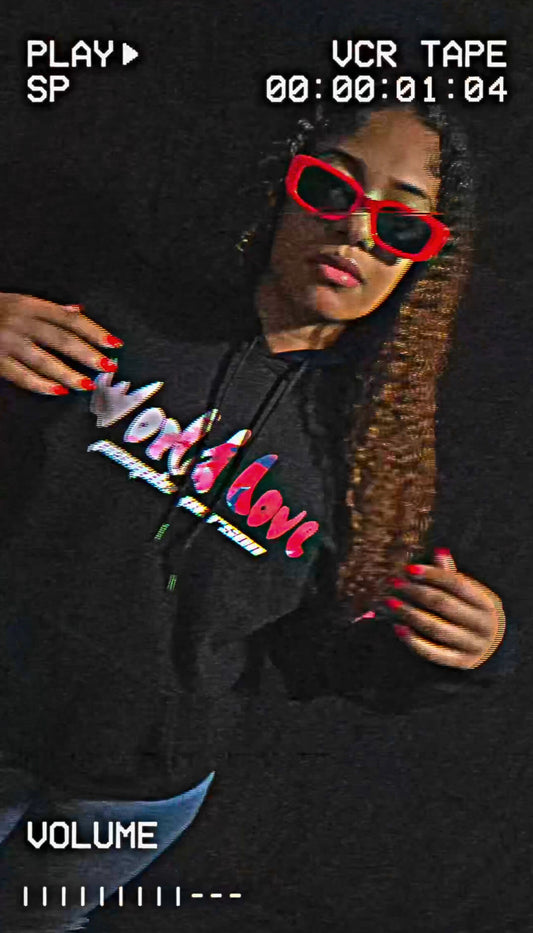 Person wearing Black People Person hoodie with colorful text and butterfly designs on a dark background